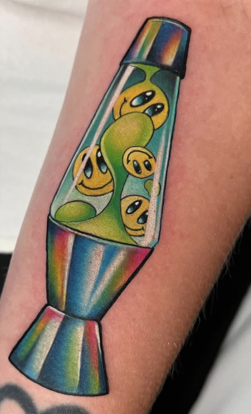 New-school lava lamp with a rainbow chrome base and melting yellow smiley faces floating in green lava, forearm